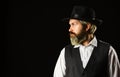 Man with retro Hat. brutal bearded hipster in suit vest. mafia gentlemen club. mature cowboy. detective acknowledgement Royalty Free Stock Photo