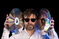 Man a retro laser discs Royalty Free Stock Photo