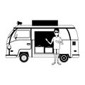 Man with retro van and luggage inside in black and white