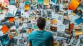 Man Reviews Diverse Images And Notes On A Wall Royalty Free Stock Photo