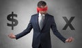 Man with ribbon on his eye holding dollar signs Royalty Free Stock Photo