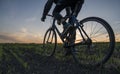 Man ride a bicycle in sunset. Riding a Bicycle at Sunset. Healthy Lifestyle Concept. Male ride bicycle in sun set. Biker