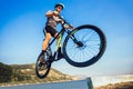 Man ride mountain bike on the beach. Royalty Free Stock Photo