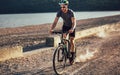 Man ride mountain bike on the beach. Royalty Free Stock Photo