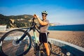 Man ride mountain bike on the beach. Royalty Free Stock Photo