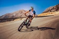 Man ride mountain bike on the road. Royalty Free Stock Photo