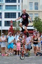 Man ride unicycle during a street performance Royalty Free Stock Photo