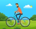 Man rides bicycle on forest road. Male character doing sports in spring city park sunny day Royalty Free Stock Photo