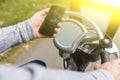 Man rides bicycle and holding black mobile phone Royalty Free Stock Photo