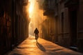 Man rides bicycle in narrow empty city street at sunset. Man silhouette with bike on empty Spanish city old town street