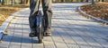 A man rides electric unicycle in city park. Royalty Free Stock Photo
