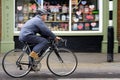 A man rides his bicycle alone on a country town Royalty Free Stock Photo