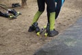 A man rides roller skis in a winter park. The beginning of winter Royalty Free Stock Photo