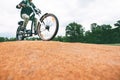 Man rides a walking bike. Walk around the park on a bike