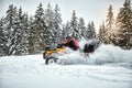 Winter race on an ATV on snow in the forest. Royalty Free Stock Photo