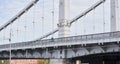 Man riding on bicycle across the bridge in the city. Royalty Free Stock Photo