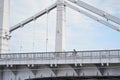 Man riding on bicycle across the bridge in the city. Royalty Free Stock Photo