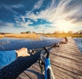 Man riding on a bicycle across the bridge Royalty Free Stock Photo