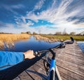 Man riding on a bicycle across the bridge Royalty Free Stock Photo