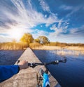 Man riding on a bicycle across the bridge Royalty Free Stock Photo