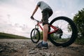 Man riding a bicycle along country road Royalty Free Stock Photo