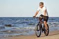 Man riding bicycle in beach Royalty Free Stock Photo