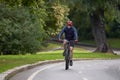 Man riding on bicycle on a bike path in the city. Royalty Free Stock Photo