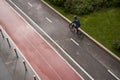 Man riding on bicycle on a bike path in the city. View from above. Royalty Free Stock Photo
