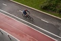 Man riding on bicycle on a bike path in the city. View from above. Royalty Free Stock Photo