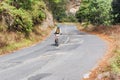 Man riding bicycle in the highlands of Guatemala.