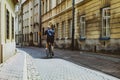 Man riding bicycle at the old streets of Warsaw