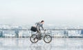 Man riding bicycle on penthouse balcony Royalty Free Stock Photo