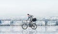 Man riding bicycle on penthouse balcony Royalty Free Stock Photo