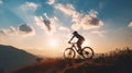 Man Riding Bicycle Up Hill at Sunset Royalty Free Stock Photo