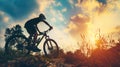 Man Riding Bicycle Up Hill at Sunset Royalty Free Stock Photo