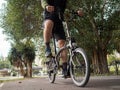 Man riding a bike along the bike path in the city Royalty Free Stock Photo