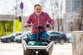 Man riding a cargo bike in the city