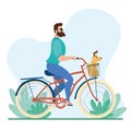 Man riding a classic bicycle with a dog in a basket