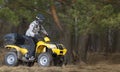 Man riding dirty 4x4 ATV quad bike Royalty Free Stock Photo