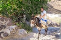 man riding donkey