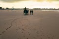 A man riding a donkey at sunrise in Shela Beach in Lamu Island, Kenya