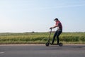 Man riding an electric scooter