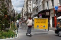 Man riding a electric scooter in Paris, Fance in a pedestrian zone