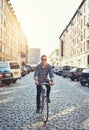 Man riding his bike through the city Royalty Free Stock Photo