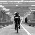 Man riding his bike in the cycling lane on Williamsburg Bridge, Brooklyn, New York City. Royalty Free Stock Photo