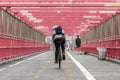 Man riding his bike in the cycling lane on Williamsburg Bridge, Brooklyn, New York City. Royalty Free Stock Photo