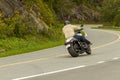 A man is riding his Suzuki Boulevard M109R motorcycle through the scenic mountain road Skyline Drive