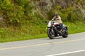 A man is riding his Suzuki Boulevard M109R motorcycle through the scenic mountain road Skyline Drive
