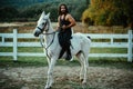 Man riding a horse. Hunky cowboy rides horse. Country life concept.