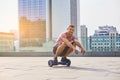 Man riding hoverboard, urban background. Royalty Free Stock Photo